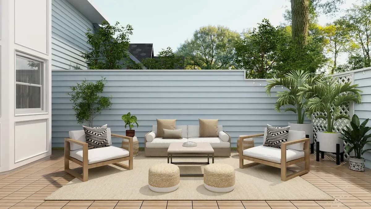 Small courtyard patio with chairs and privacy fencing
